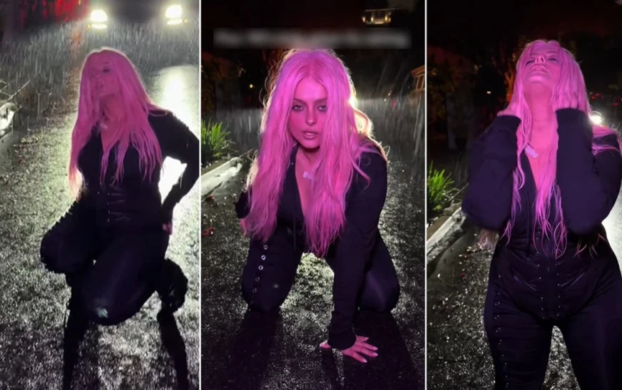 Bebe Rexha publikon video duke kërcyer dhe bërë lëvizje provokuese jashtë në shi